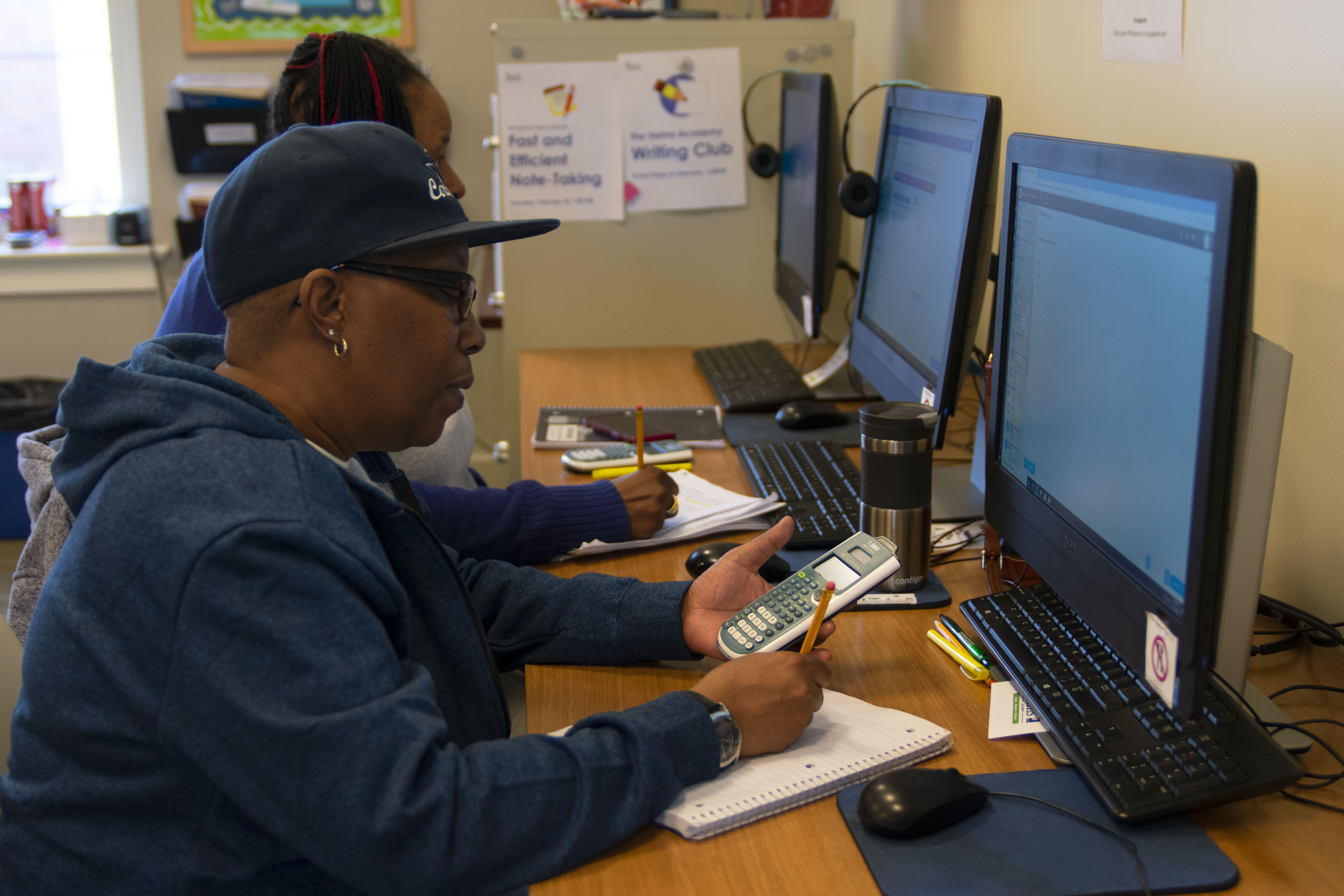 Helms Academy adult students working at computers